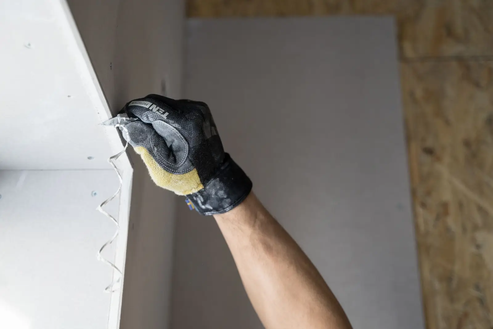 Fixing a sheet of plasterboard